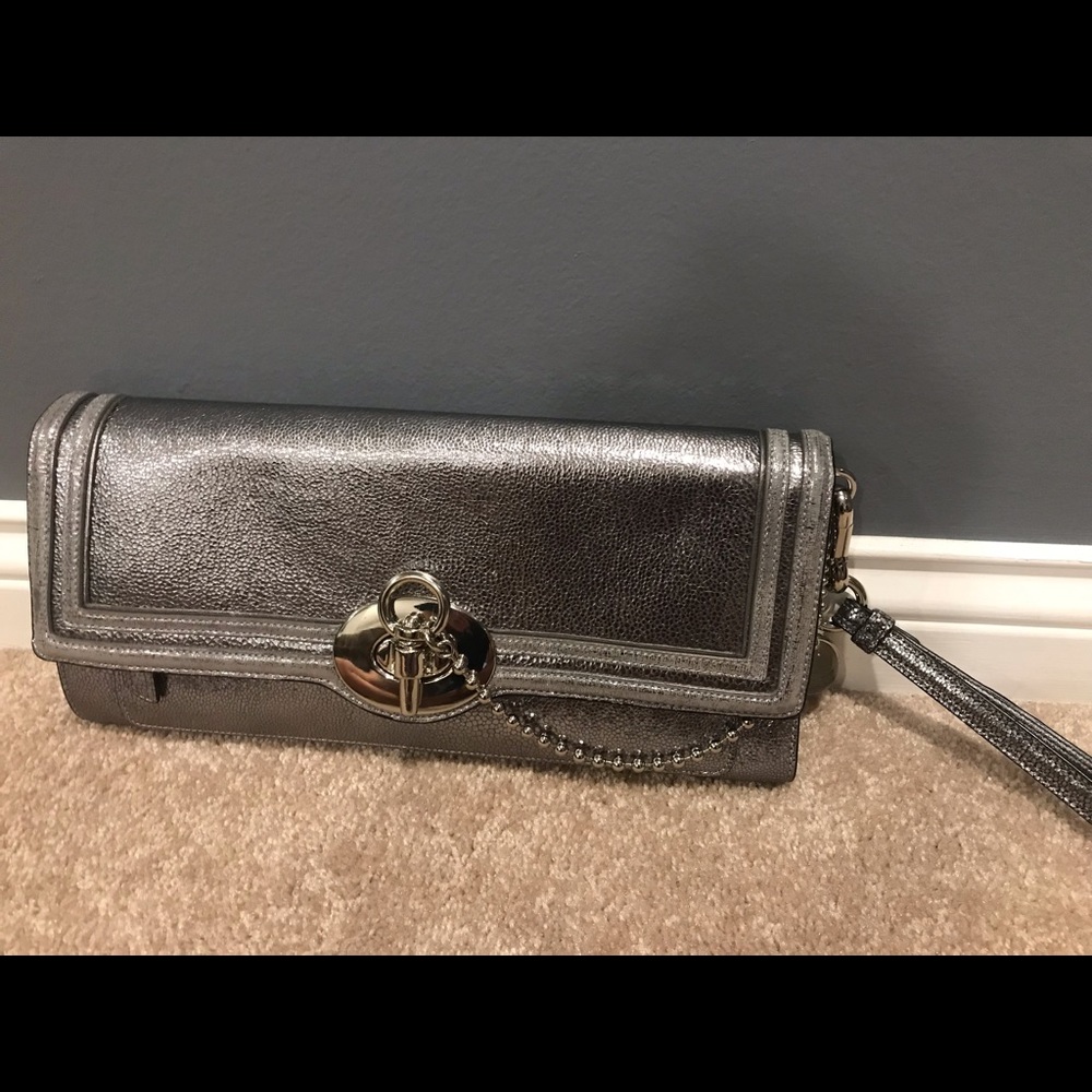 NWOT Silver Coach clutch w/ shoulder strap.